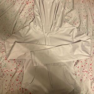 White zip-up hoodie with a relaxed fit similar to Lulu lemon